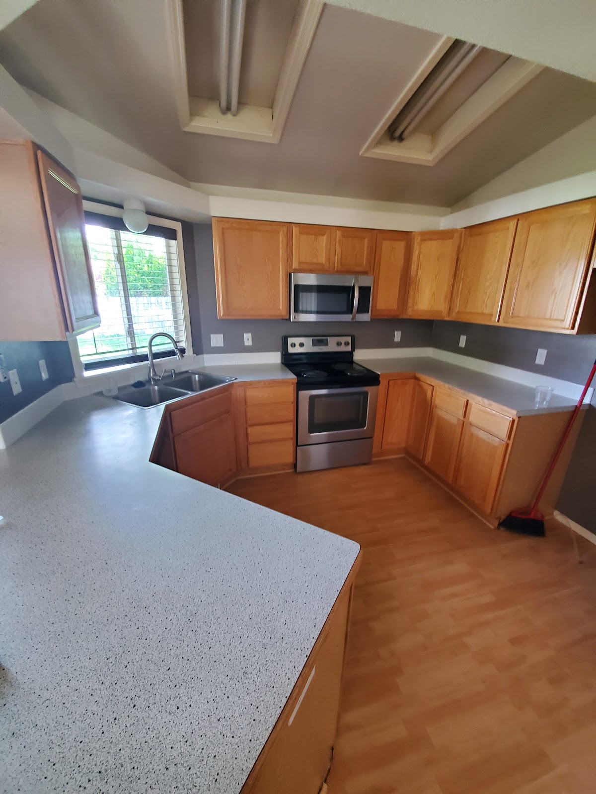 Move-out cleaning of an empty Idaho kitchen by Sophisticated Cleaners